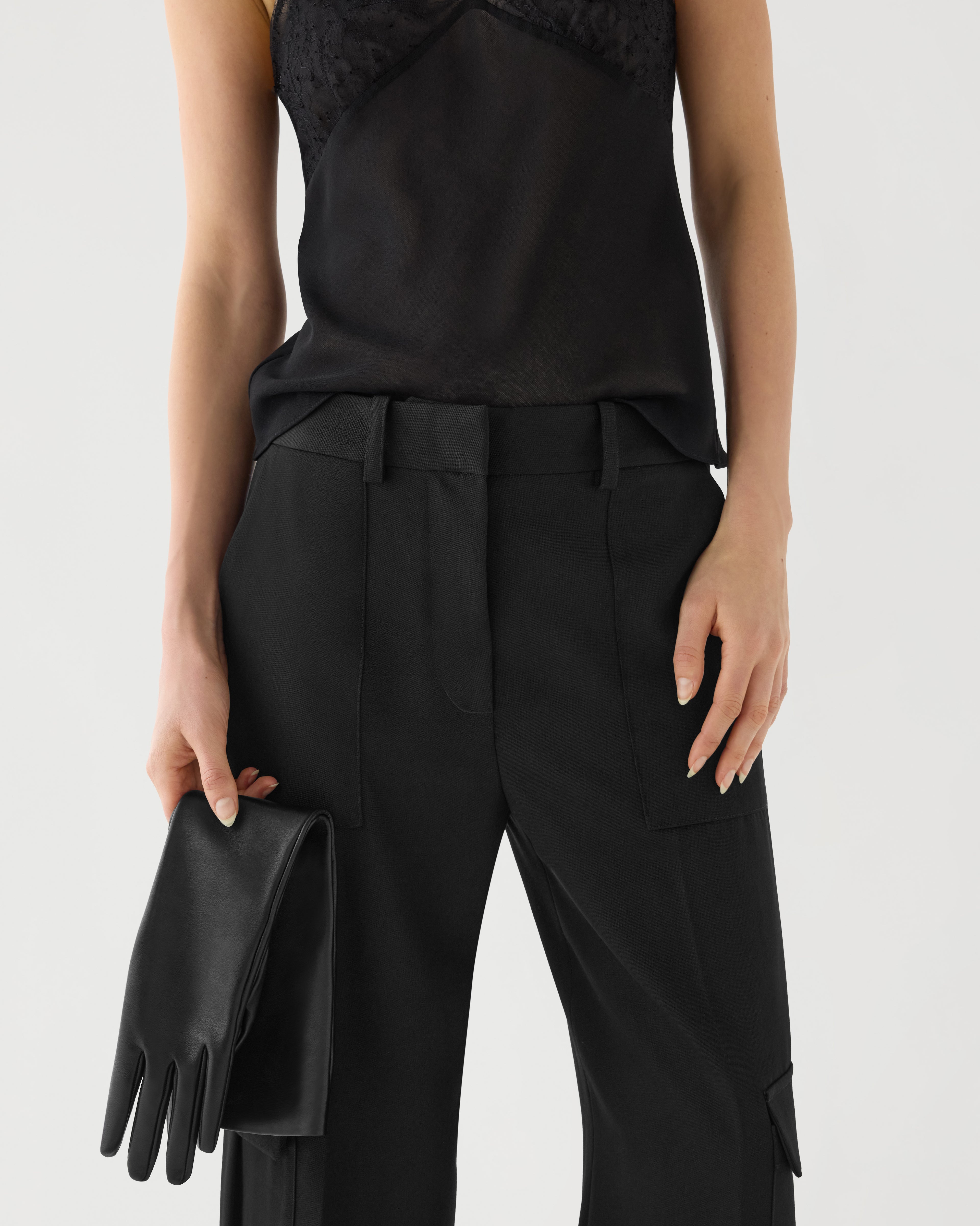 Black Etta trousers in grain de poudre wool by Veronica De Piante, featuring tailored design and classic fit.