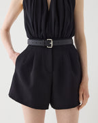 Black Tilly Grain de Poudre wool shorts, high-waisted, pleated, tailored, side pockets, worn by model