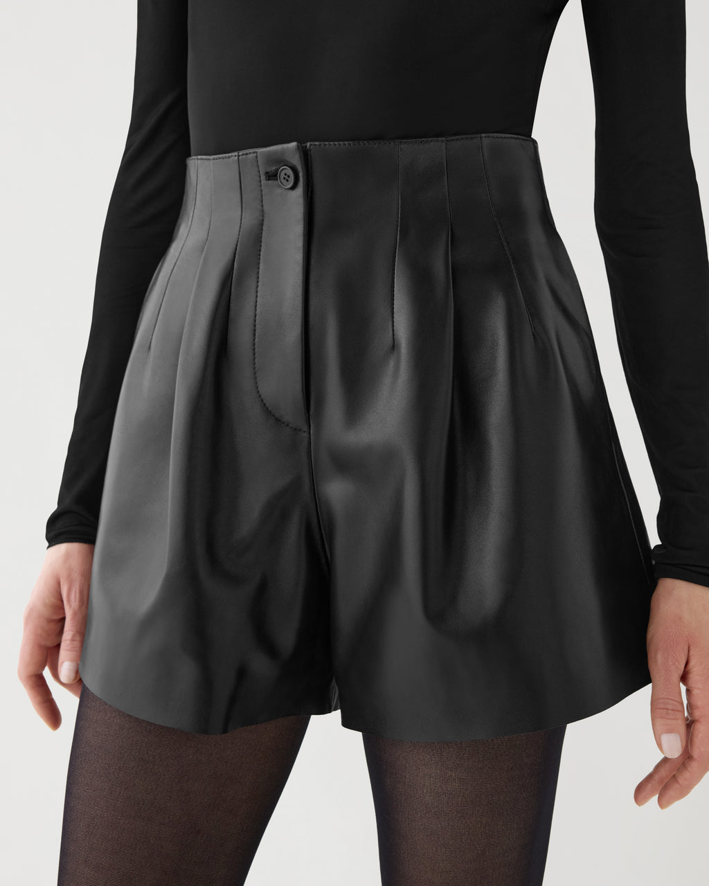 Women's Tilly black high-waisted lightweight nappa leather pleated shorts, tailored silhouette, horn button detail