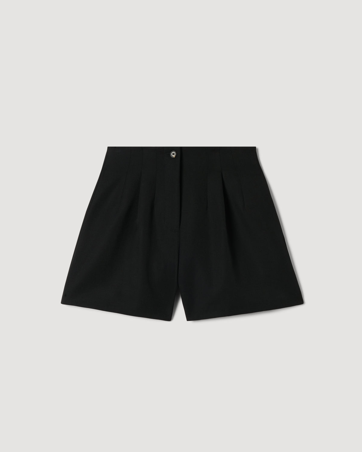 Black Tilly Short in Grain de Poudre wool packshot. High-waisted, pleated tailored shorts with a horn button front closure