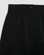 Black Tilly Short packshot. High-waist Grain de Poudre wool shorts with pleated front, horn button