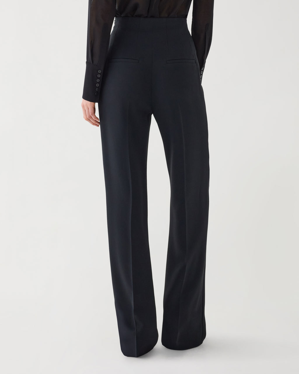 Black Naya Trouser in stretch viscose crepe fabric, showcasing a sleek, tailored bottom for a modern, sophisticated look.