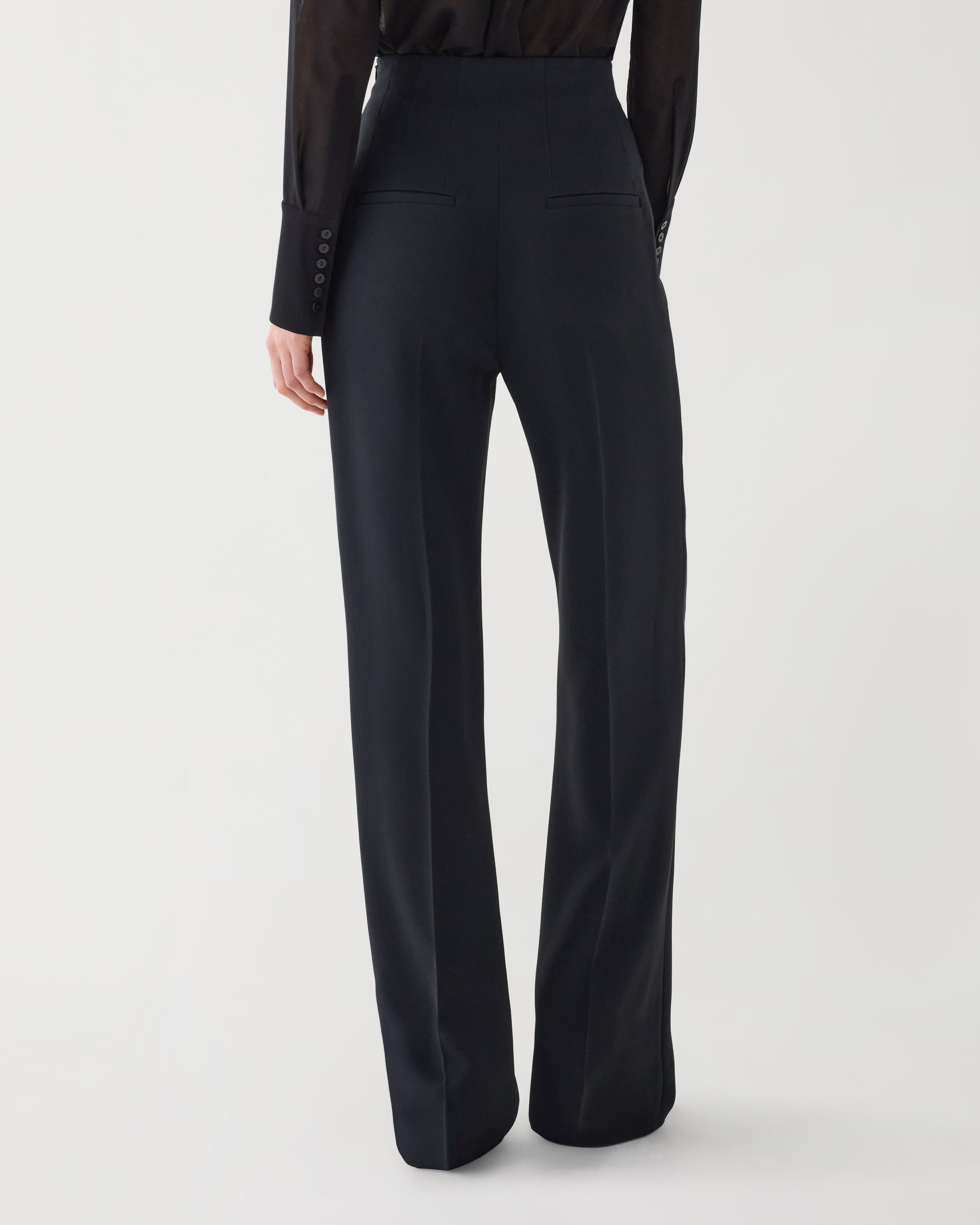Black Naya Trouser in stretch viscose crepe fabric, showcasing a sleek, tailored bottom for a modern, sophisticated look.