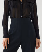 Black Naya trouser in stretch viscose crepe, showcasing a tailored bottom with a sleek, fitted design.