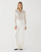 Off-white Naya Trouser in stretch viscose crepe, featuring a sleek design and tailored fit. Perfect for stylish outfits.