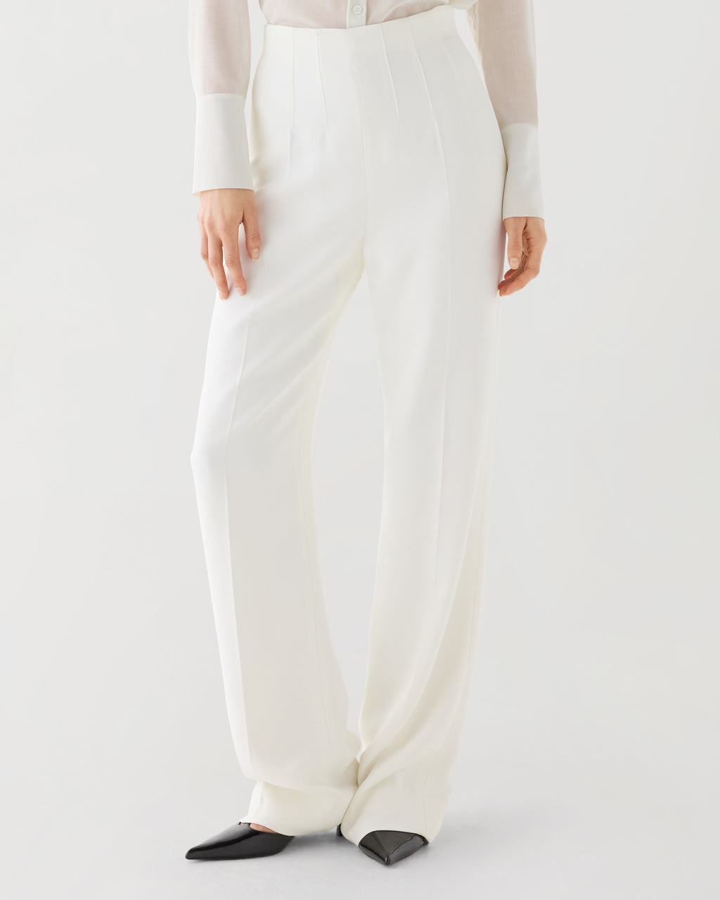 Off-white Naya trousers in stretch viscose crepe, featuring a sleek design and tailored fit for stylish bottoms.