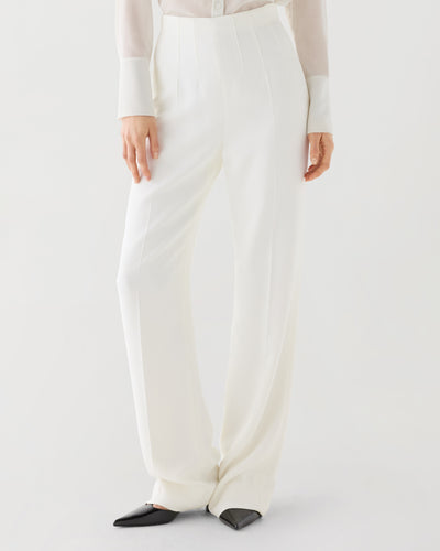 Off-white Naya trousers in stretch viscose crepe, featuring a sleek design and tailored fit for stylish bottoms.
