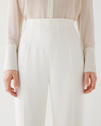 Off-white Naya trousers made from stretch viscose crepe, showcasing a sleek, tailored fit for a stylish look.