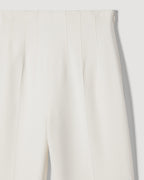 Off-white Naya trousers made of stretch viscose crepe, featuring a sleek and tailored fit for stylish bottoms.