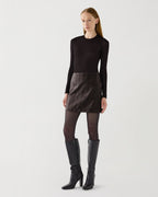 Model in Vienna Bodysuit, luxurious sheer chocolate jersey long-sleeve fitted round neck top