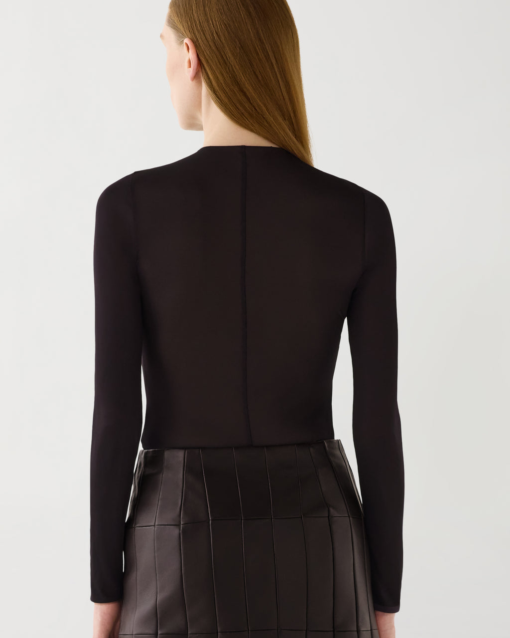 Chocolate Vienna Bodysuit, sheer stretch jersey long-sleeve. Smooth, luxurious layering top, back view on model