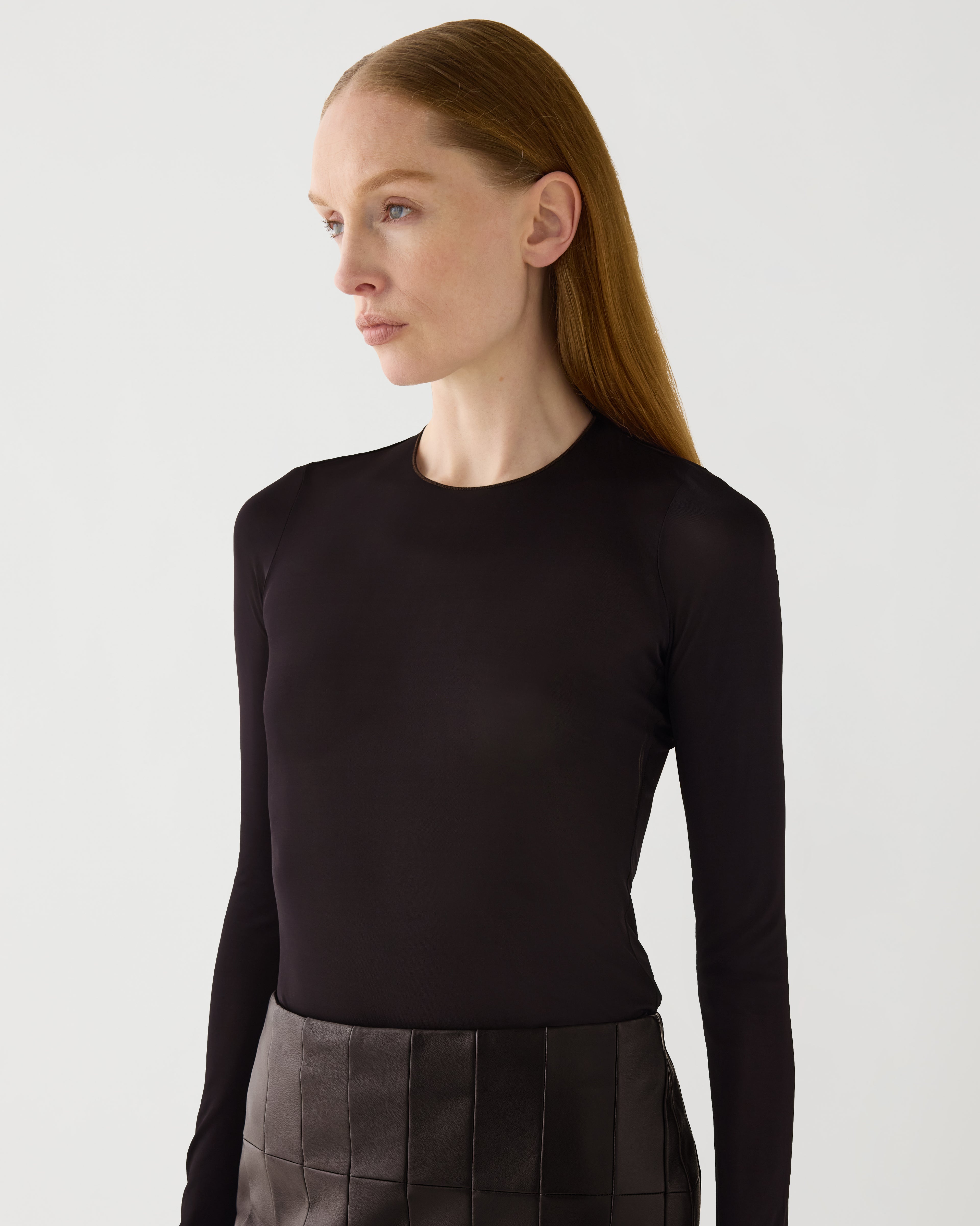Vienna Bodysuit, chocolate semi-sheer stretch jersey, fitted long-sleeve, round neckline, on female model