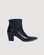 Black patent leather Paloma Boots by Veronica De Piante, showcasing sleek ankle shoes with shiny finish and stylish design.