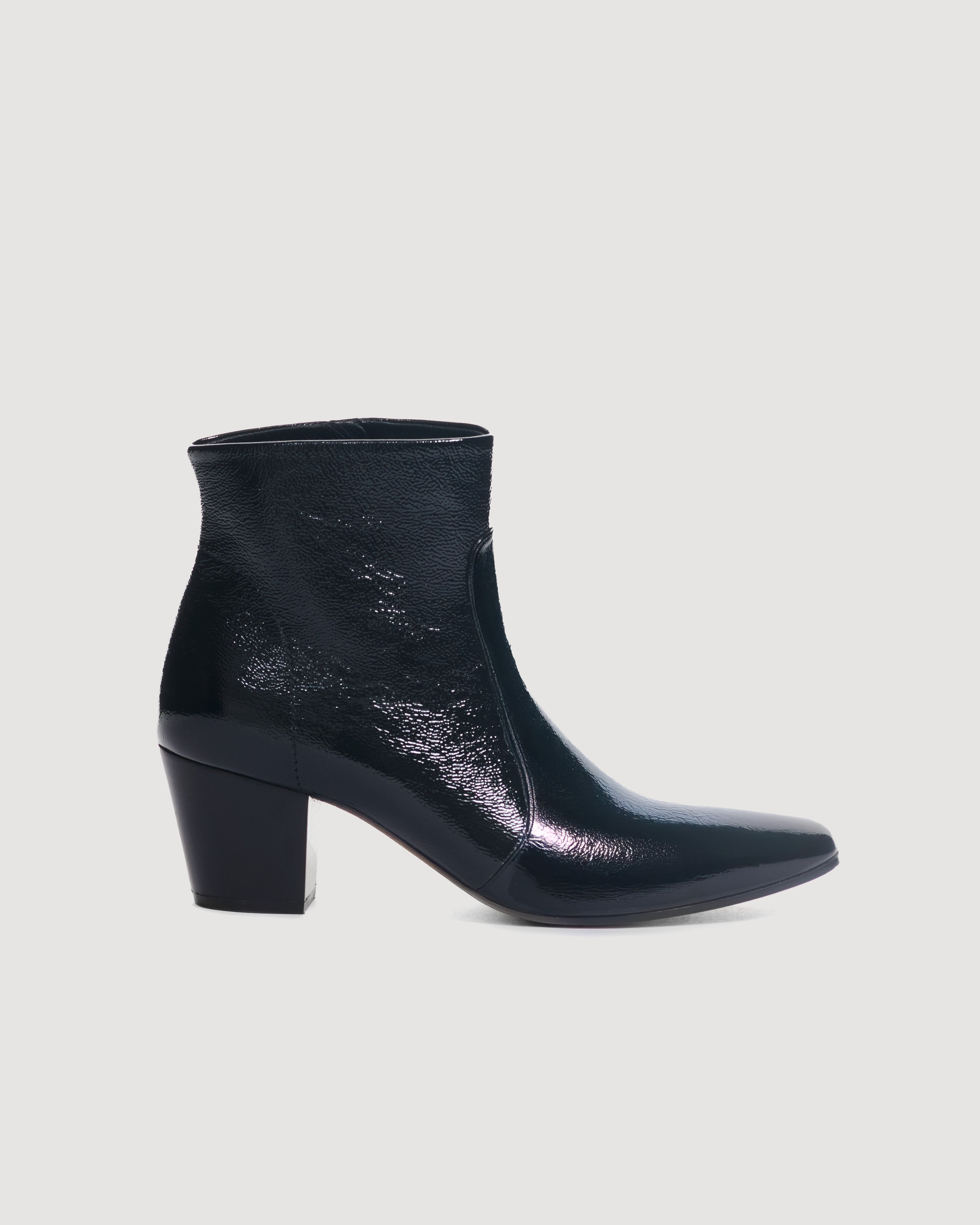 Black patent leather Paloma Boots by Veronica De Piante, showcasing sleek ankle shoes with shiny finish and stylish design.