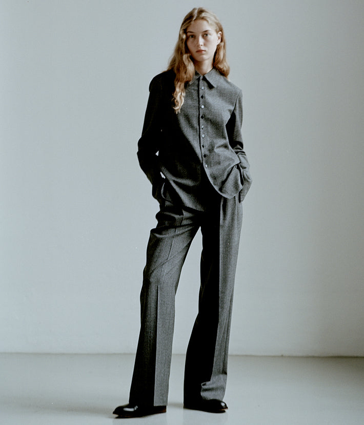 Luxury women's heather grey wool suit. Relaxed collared shirt and wide-leg tailored trousers