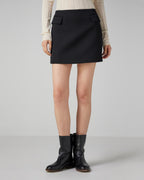 Black Cecily skirt with pockets in wool twill by Veronica De Piante, shown in a stylish, fitted design.