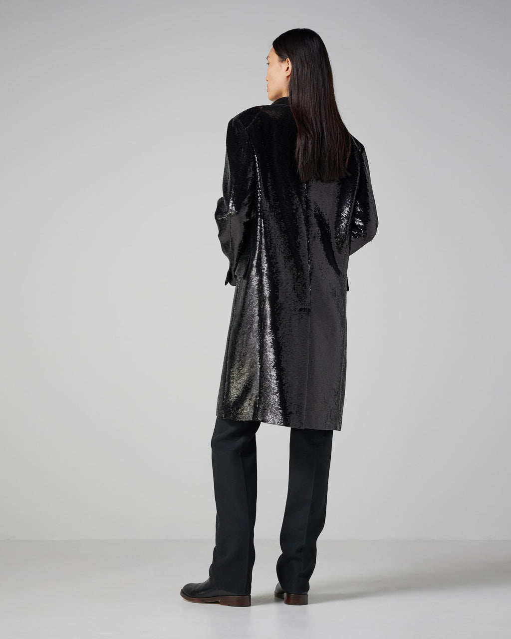 Black Arlo coat with flat sequins, featuring a stylish design perfect for evening wear and outerwear.