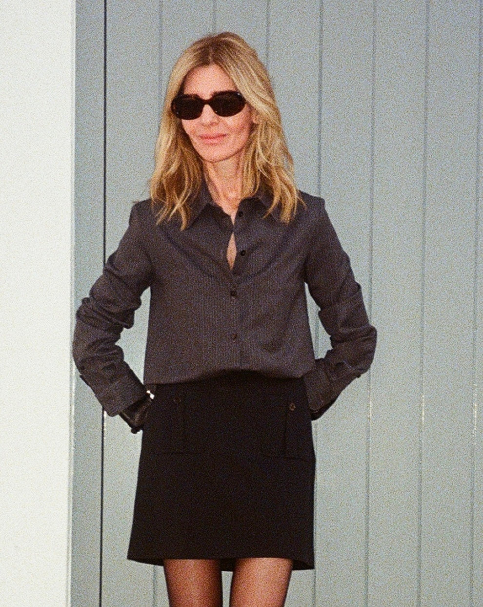 Black Sabine skirt by Veronica De Piante in stretch wool twill fabric, shown hanging on a white background.