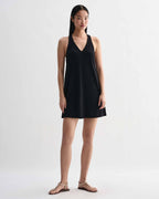Black Vittoria dress by Veronica De Piante in stretch viscose jersey, shown on a hanger with a fitted silhouette.
