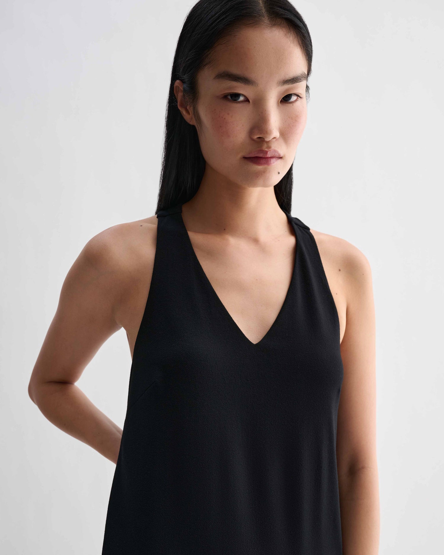 Black Vittoria dress by Veronica De Piante in stretch viscose jersey, featuring a sleek, fitted silhouette and elegant neckline.